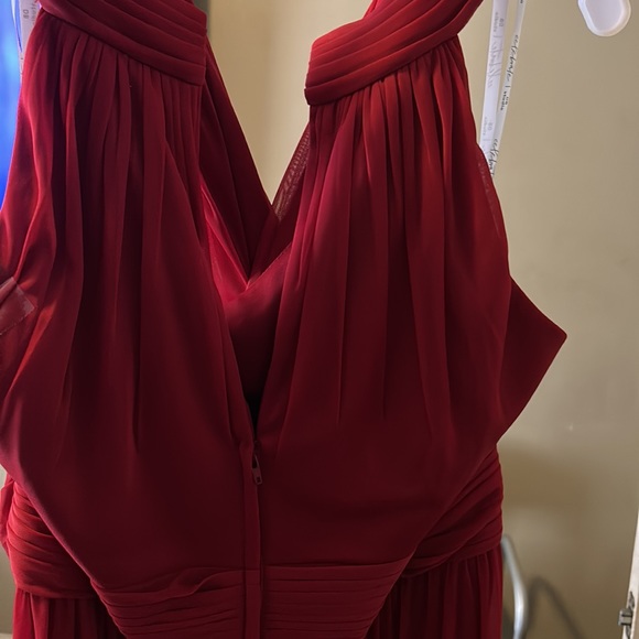 It’s the 2nd bridesmaid dress in candy apple red and it has a split on side - Picture 3 of 6